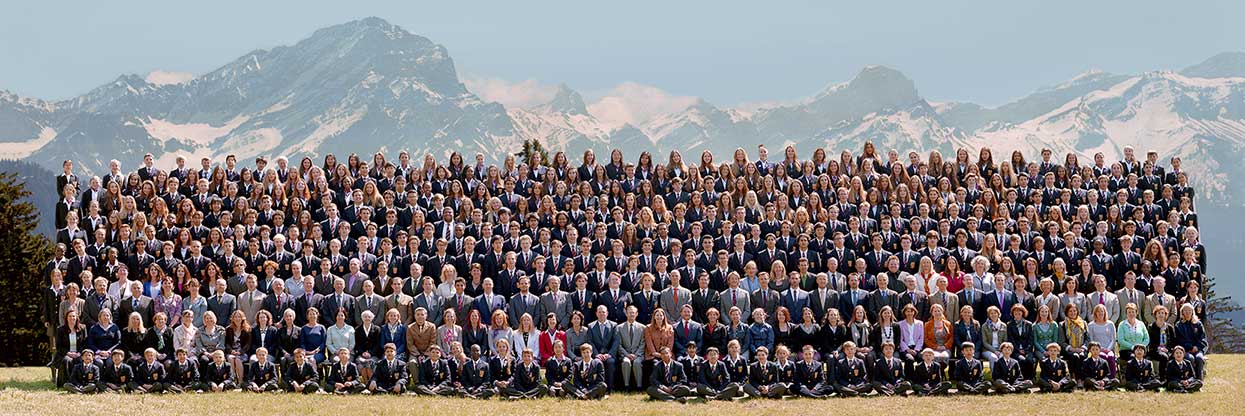 School photograph in Switzerland, with the mountains in the background.
